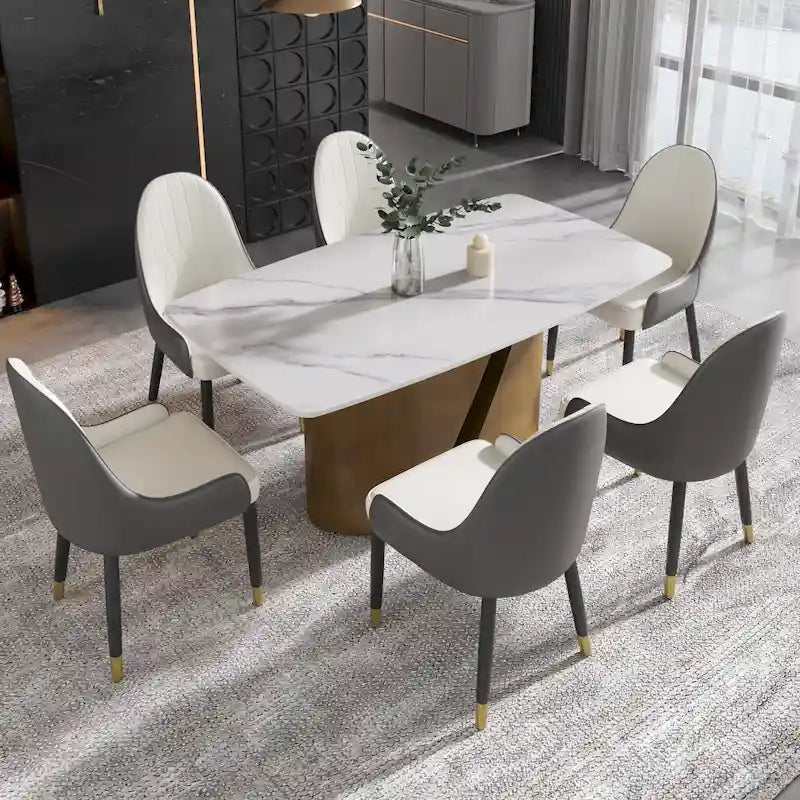 Table de salle à manger moderne en marbre avec plateau en pierre frittée et pieds en métal finition or