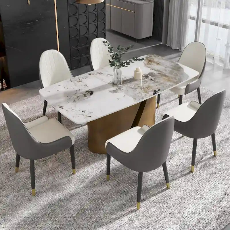 Table de salle à manger moderne en marbre avec plateau en pierre frittée et pieds en métal finition or