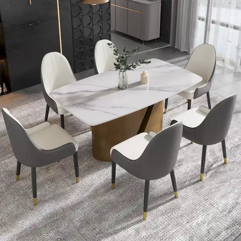 Table de salle à manger moderne en marbre avec plateau en pierre frittée et pieds en métal finition or